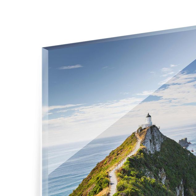 Glasbilleder strande Nugget Point Lighthouse And Sea New Zealand