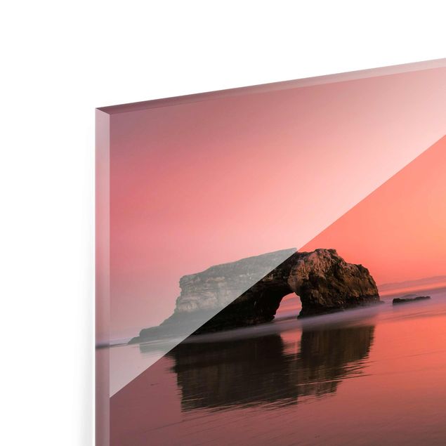 Glasbilleder strande Natural Bridge In The Sunset