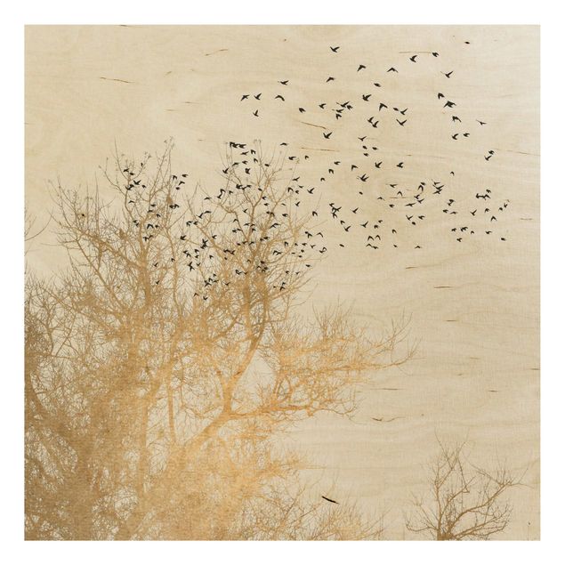 Prints på træ landskaber Flock Of Birds In Front Of Golden Tree