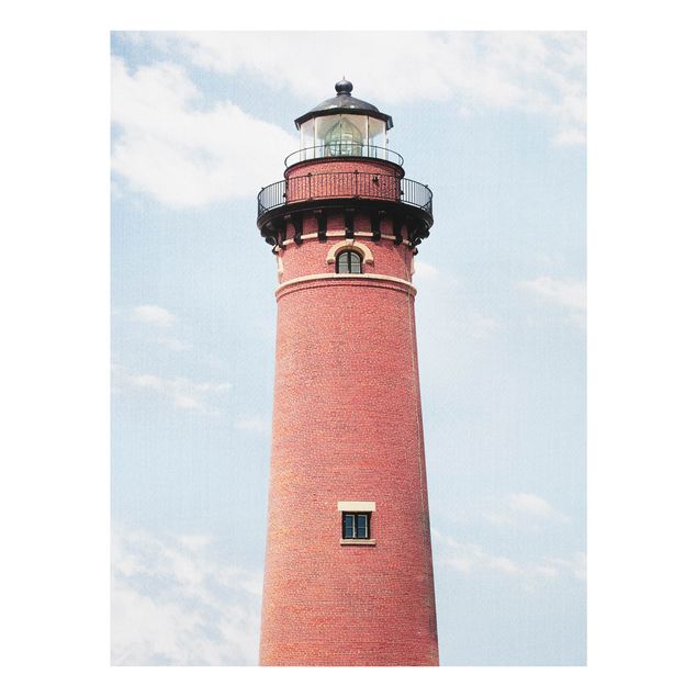 Glasbilleder strande Red Lighthouse On Sky Blue Backdrop